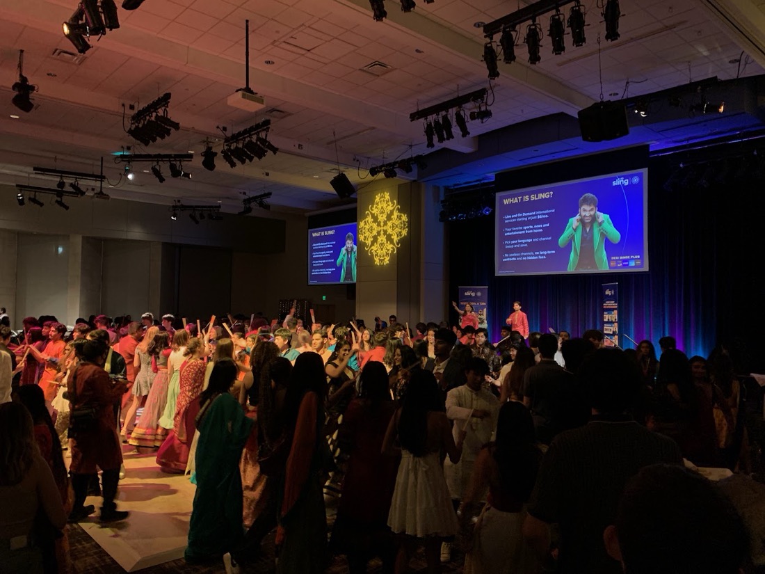 Students dancing garba in a packed hall at Vanderbilt University